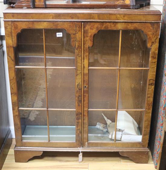 A figured walnut bookcase, W.90cm